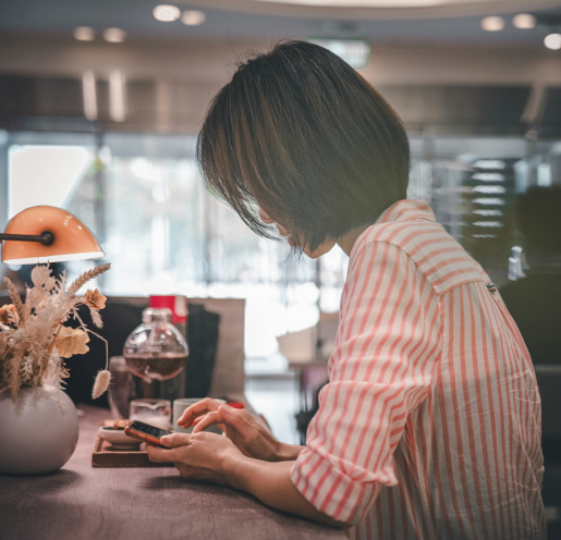 A finance professional reviewing positions on a mobile device in an institutional setting